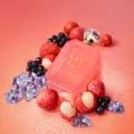 Eden Sparkling Lychee | 39 Kayali Eau de Parfum bottle with lychees and flowers