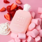 Yum Boujee Marshmallow | 81 bottle lying among strawberries and pink marshmallows