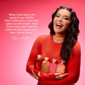 Woman in red holding the four Eden Obsessions miniatures against a pink background