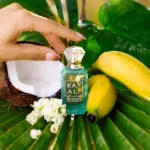 Maui in a Bottle Sweet Banana | 37 bottle with coconut, bananas and white flowers on palm leaves