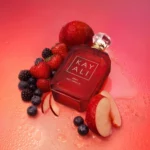 Eden Juicy Apple | 01 Kayali Eau de Parfum bottle with red apples and berries