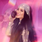 Woman in a sparkling crystal headpiece holding a Lovefest Burning Cherry | 48 bottle near her face