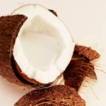 Fresh coconut halves, an ingredient of Maui in a Bottle Sweet Banana | 37