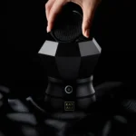 Hand lifting the mesh lid off the Oudgasm Diamond Bakhoor Burner