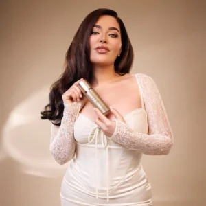 Woman with long dark hair spraying a Déjà Vu White Flower | 57 Body Spray