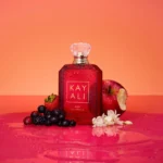 Eden Juicy Apple | 01 Kayali Eau de Parfum bottle with an apple