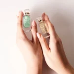 Yum Mini Duo Pistachio Gelato and Boujee Marshmallow mini bottles held in hands