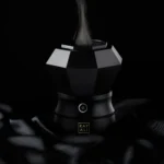 Oudgasm Diamond Bakhoor Burner in use with scented smoke rising from the top